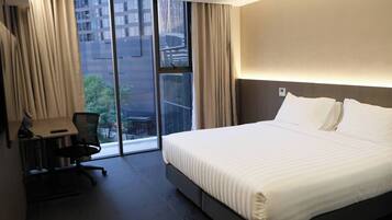 Deluxe Double Room, City View | In-room safe, desk, laptop workspace, blackout curtains