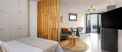 Junior Apartment, Patio, Sea View | In-room safe, blackout drapes, soundproofing, iron/ironing board