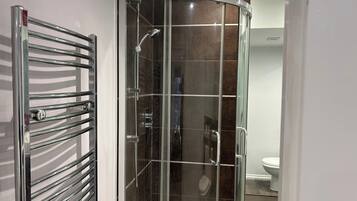 Combined shower/bathtub, deep-soaking bathtub, hair dryer, towels