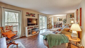 A cozy living room with a fireplace, comfortable seating, and a dining area. - Near Lakes & Trails! Cozy Hot Springs Hideaway (Hot Springs Village)
