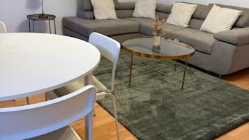 Apartment, City View | Living area | Flat-screen TV