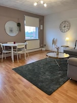 Apartment, City View | Living area | Flat-screen TV