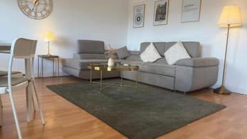 Apartment, City View | Living area | Flat-screen TV