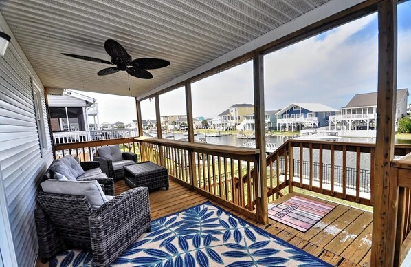 Terrace/patio - 3-bedroom canal home in delightful Ocean Isle Beach with boat dock. (Ocean Isle Beach)