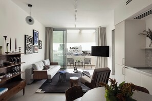 Superior One-Bedroom Apartment with Balcony | Living area | TV - Mr Bialik - By TLV2GO (Tel Aviv)