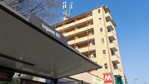 A multi-story building with a sign reading "Inganni M1". - CHECK-INGANNI, above MM1 Inganni and next to the Italian Diagnostic Center (Milano)