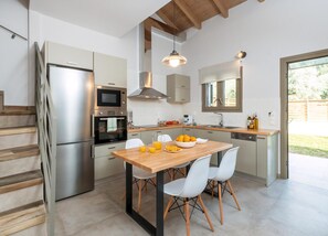 Fridge, oven, dishwasher, dining tables