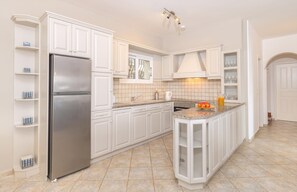 Fridge, oven, dishwasher, dining tables