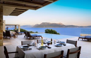 Outdoor dining - Elegant Contemporary Villa with Spectacular Ionian Views and Sea Access (Meganissi)