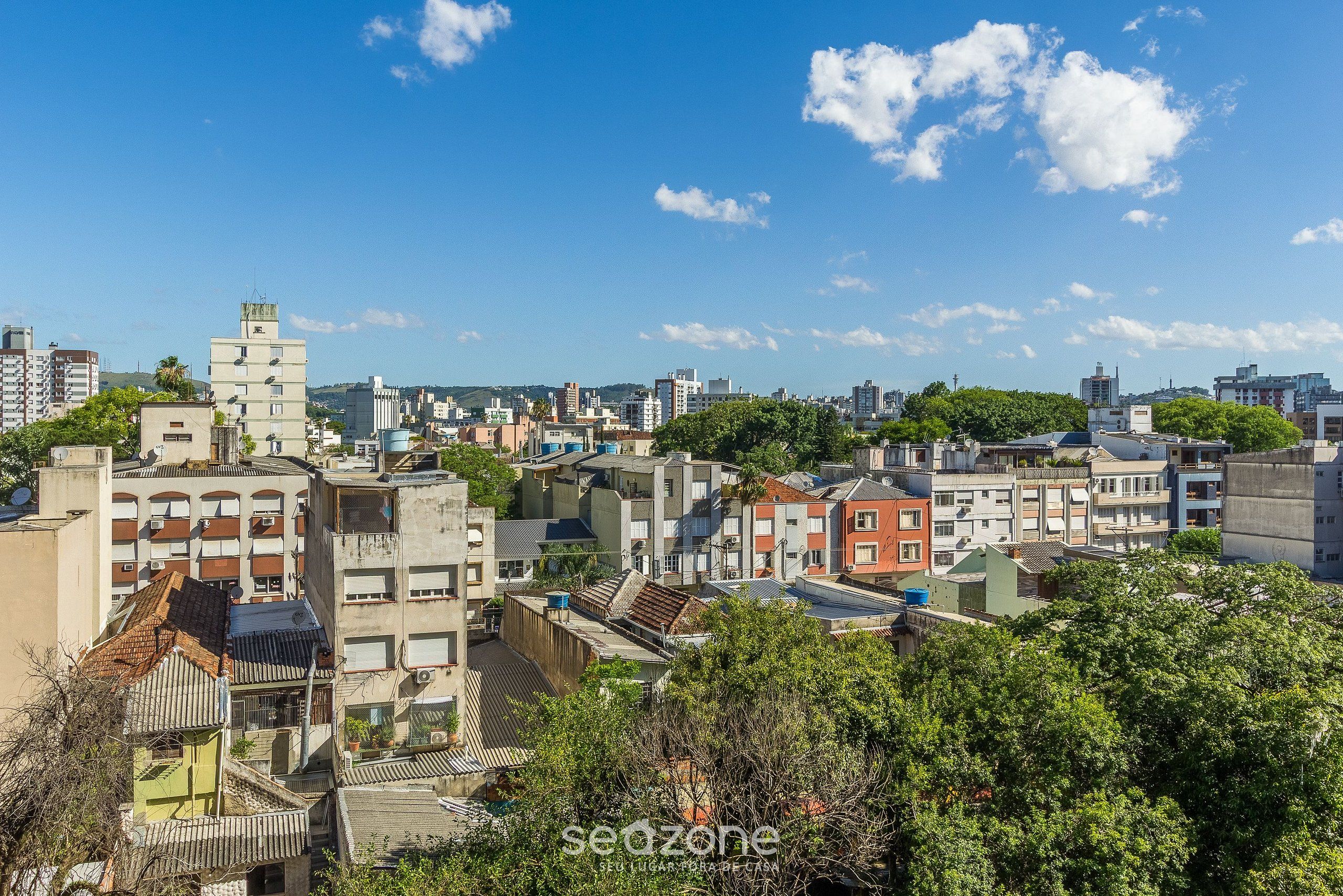 A cityscape with various buildings, including a mix of residential and commercial structures.