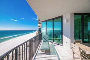 A balcony with a view of a beach and ocean. - Phoenix IX 1107  by Brett/Robinson (Orange Beach)
