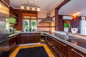Fridge, microwave, stovetop, coffee/tea maker