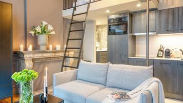 Studio Suite, Mezzanine | Living area | 40-inch flat-screen TV with digital channels