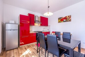 Fridge, stovetop, coffee/tea maker, cookware/dishes/utensils