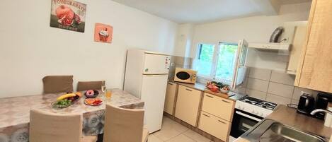 Fridge, microwave, stovetop, coffee/tea maker