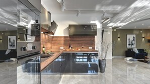 A modern kitchen with a central island, built-in appliances, and a sleek design. - Villa Orion - Private Heated Pool, Sauna & Jacuzzi (74027-K1) - Rovinj (Rovinj)