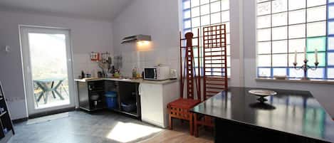 Fridge, microwave, stovetop, coffee/tea maker