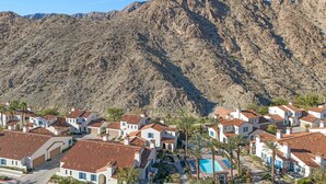 A residential area with white houses, red-tiled roofs, and a mountain backdrop. - Family Friendly Legacy Villas Retreat- Mountain Views (La Quinta)