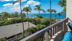 A balcony with a view of the ocean and palm trees. - Budget Friendly - Kihei Akahi C-608, Ocean Views, Short Walk to Kamaole Beach II (Kihei)