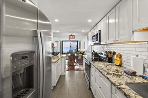 Condo, Multiple Beds, Balcony, Ocean View (Lauloa 106) | Private kitchen | Coffee/tea maker, dining tables - Oceanfront Lauloa 106 - Ground Floor, Modern Renovation, Split-ac, Walk to Beach (Wailuku)
