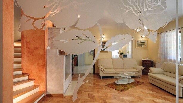 A modern living room with a staircase, a sofa, and a coffee table. - Villa Nina (V3467-K1) - Medulin (Medulin)