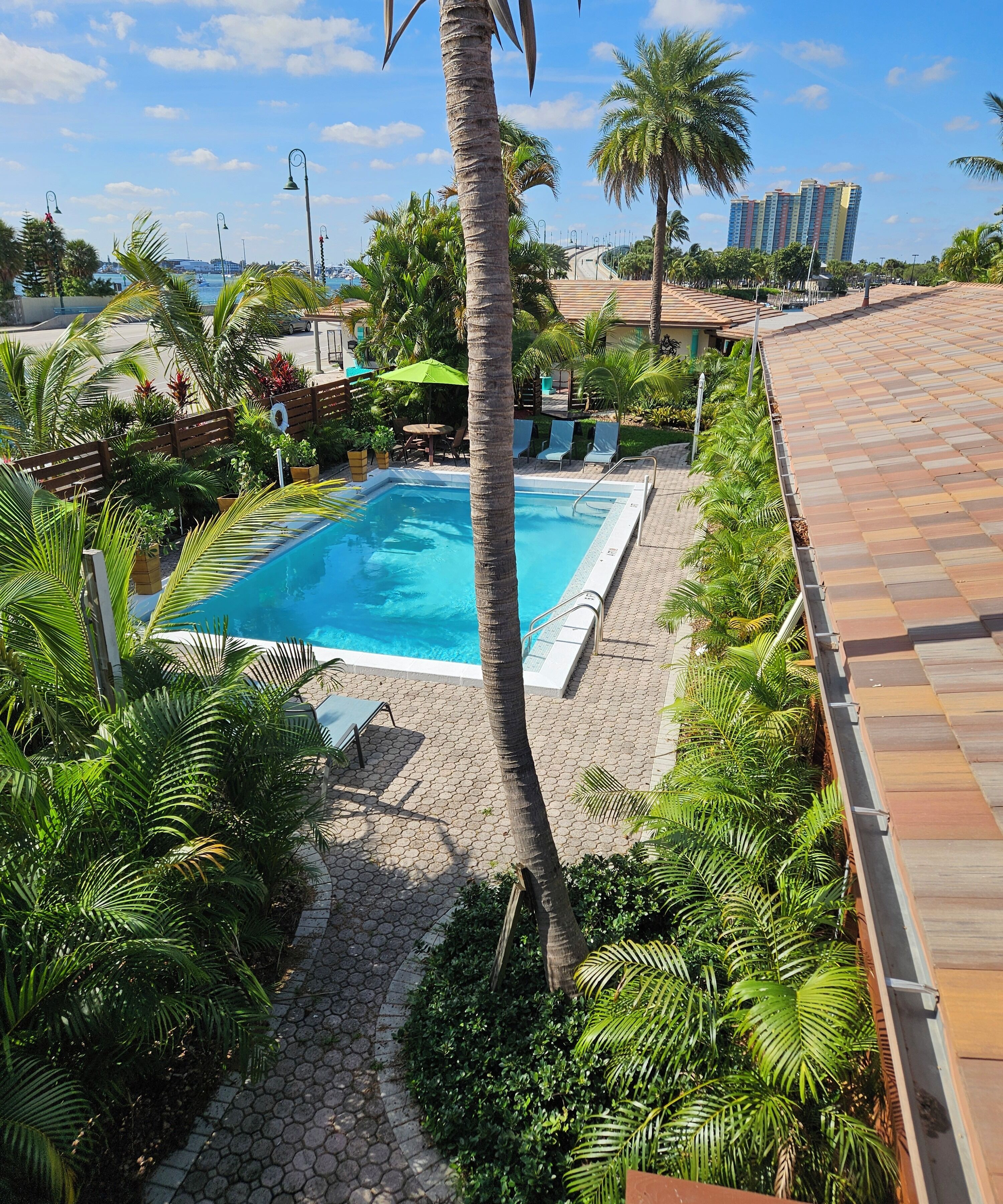 Outdoor pool, open 9:00 AM to 10:00 PM, pool umbrellas, sun loungers