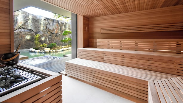 A modern spa area with wooden benches and a hot tub. -  Hayashi Residence (Sofia)