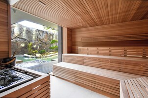 A modern spa area with wooden benches and a hot tub.