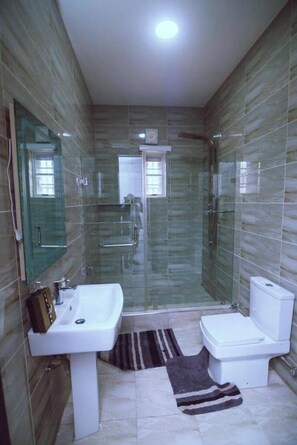 Deluxe Apartment, Balcony, City View | Bathroom | Free toiletries, hair dryer, towels, soap - Eazym Shortlet Apartment  (Abuja)