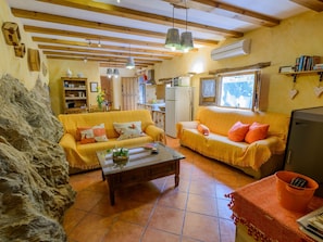TV, fireplace - Haus mit integrierter Felswand und Jacuzzi by Interhome (Laroya)