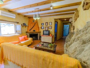 TV, fireplace - Haus mit integrierter Felswand und Jacuzzi by Interhome (Laroya)