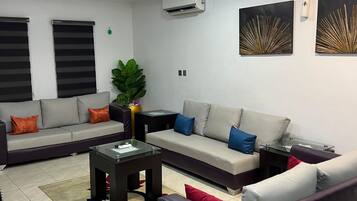 Apartment, 4 Bedrooms | Living area