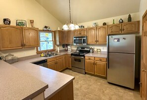 Fridge, microwave, oven, stovetop - OC80: Suite: Canal front with private boat dock and large yard (Ocracoke)