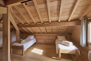 A wooden cabin with two single beds, a wooden ceiling, and a window. - Casa-Petit Laus Brand New Duplex in Queyras for 6p (Aiguilles)