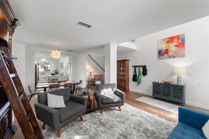 Smart TV, fireplace, books, computer monitors