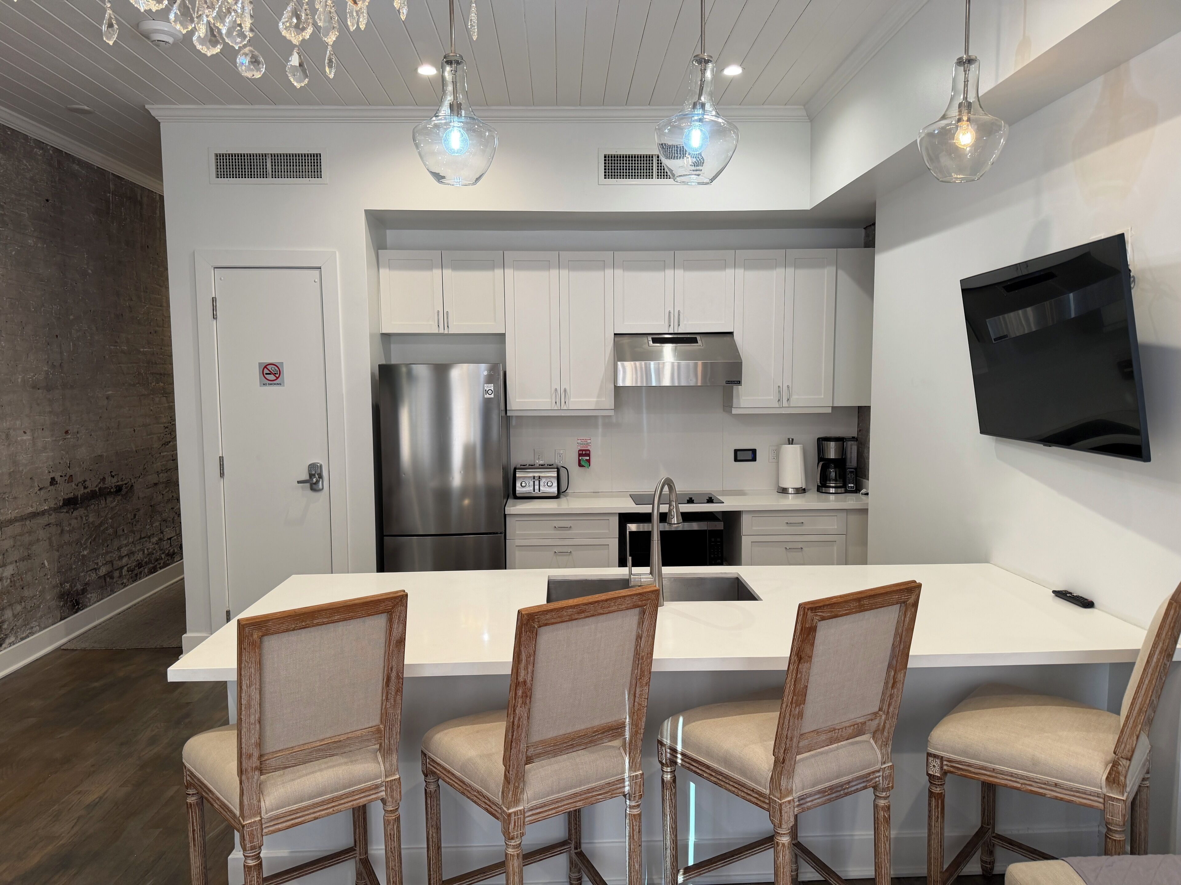 Luxury Suite, City View | Private kitchen | Full-sized fridge, microwave, stovetop, dishwasher