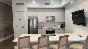 Luxury Suite, City View | Private kitchen | Full-sized fridge, microwave, stovetop, dishwasher