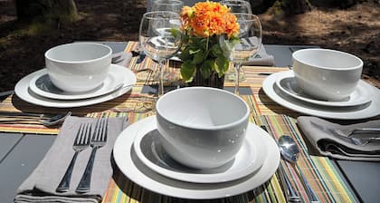 Stunning ocean view from the yard of this cozy home with balcony and fireplace