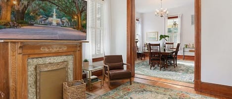 Spacious living room flowing seamlessly into the dining area—perfect for laughter, lounging, and Southern gatherings.