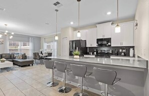 Fridge, microwave, oven, stovetop - Elegant 5 BR Home/Private pool in Champions Gate (Davenport)