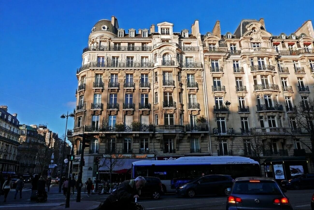 A historic building with multiple balconies and ornate architectural details.