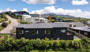 Exterior - Modern Family-Friendly Sunny Raglan Bach with Spa Pool, BBQ & Large Deck (Raglan)