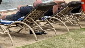 A poolside area with lounge chairs and a building in the background. - Hilton Point At Poipu Relaxing 2-bedroom resort with AC in awesome Koloa (Koloa)