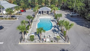 A swimming pool surrounded by palm trees and lounge chairs, with a covered pavilion nearby. - 2 beach accesses in walking distance! ~1 bd/2ba on 30A~Sleeps 4! (Santa Rosa Beach)