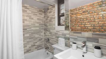 Shower, hair dryer, towels, shampoo