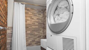 Shower, hair dryer, towels, shampoo