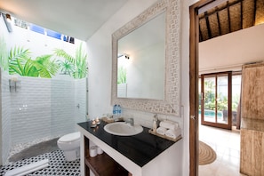 A bathroom with a white sink, a large mirror, and a shower area with a white tiled wall. - 100m to Seminyak Beach / Personal Full-Time Butler (Seminyak)