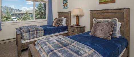 Third bedroom is perfect for the kids with these two twin beds | Upper Level