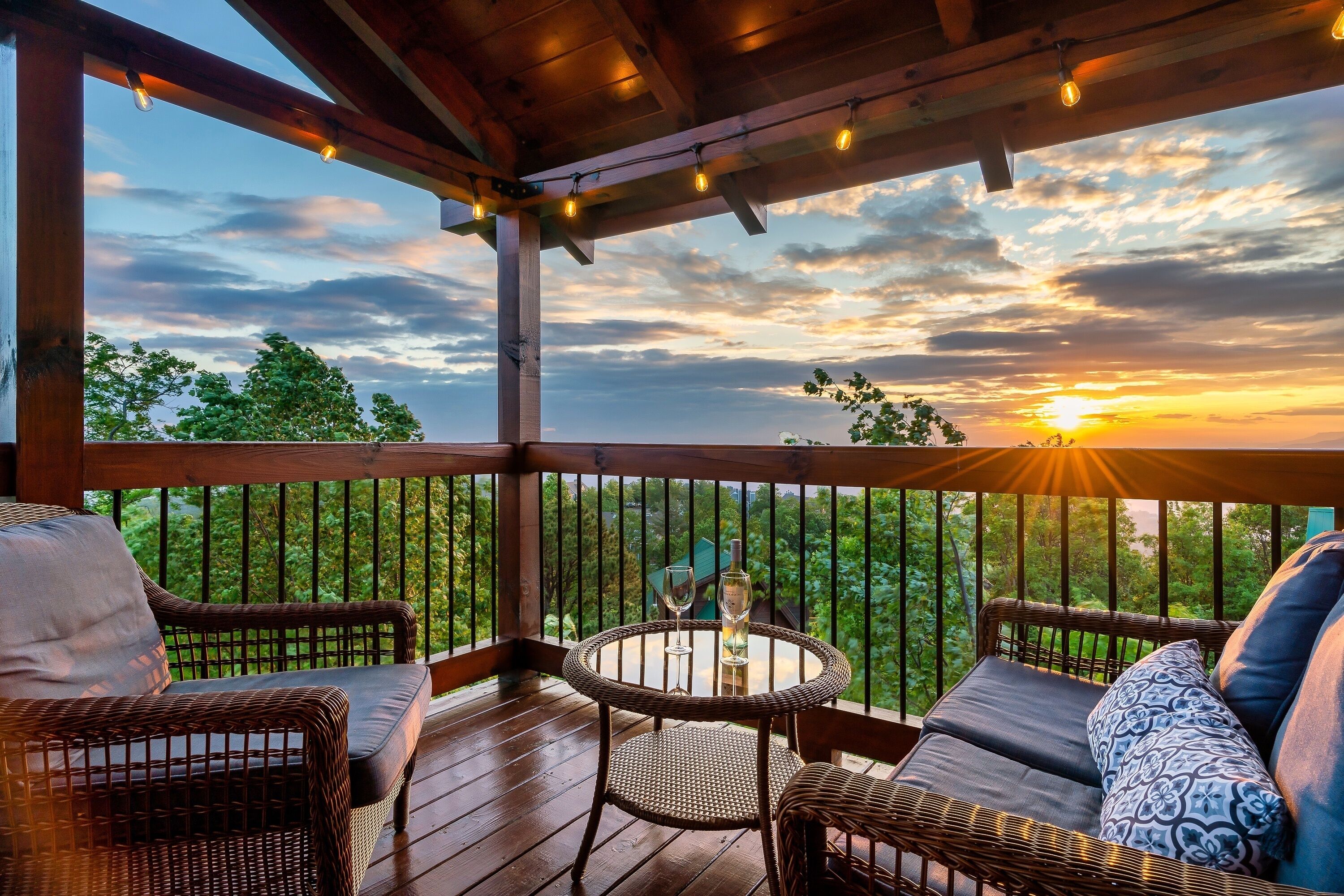 Take in the mountain sunset from the deck with comfy seating.