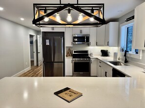 Private kitchen - Perfect 2-bedroom house in Carrabassett Valley for your getaway (Carrabassett Valley)
